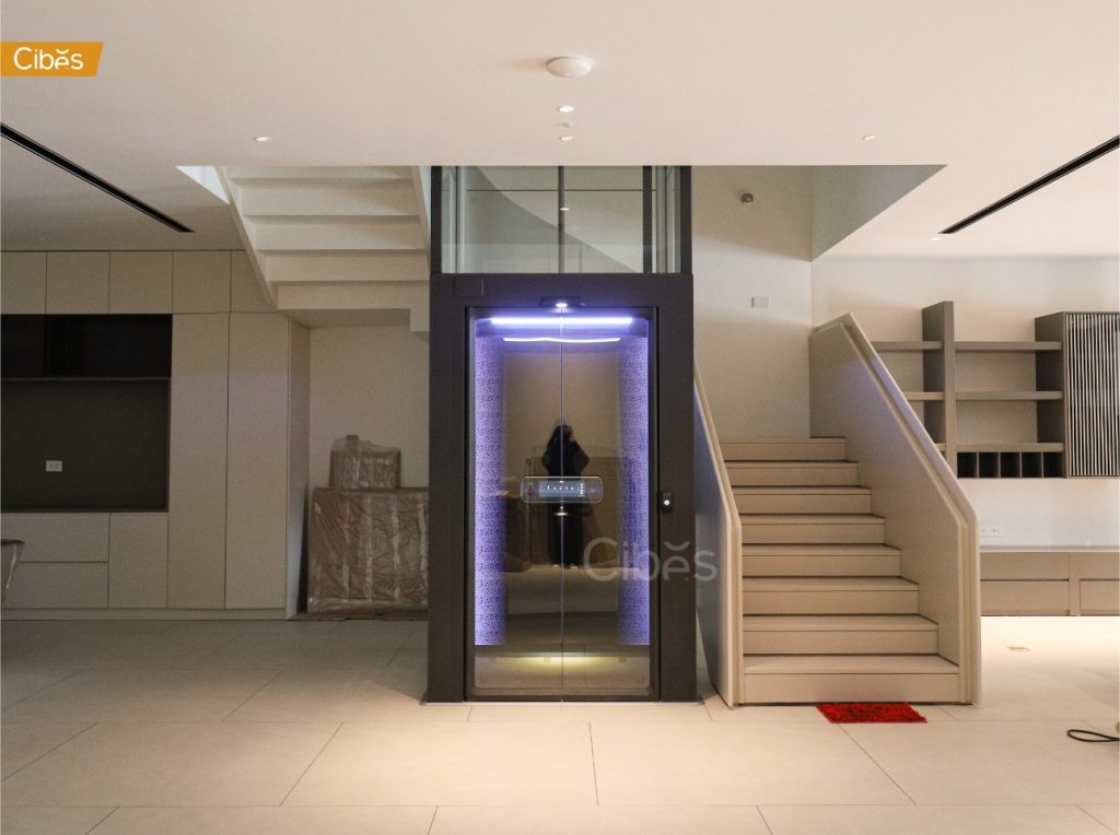 Home Elevator Installed in the Middle of a Staircase.